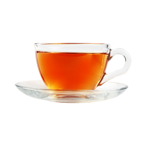black tea in a clear glass mug on a saucer