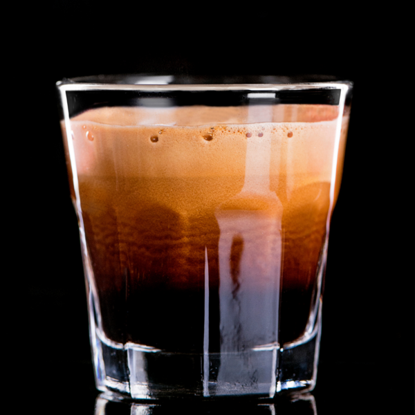 espresso with foam head in a shot glass